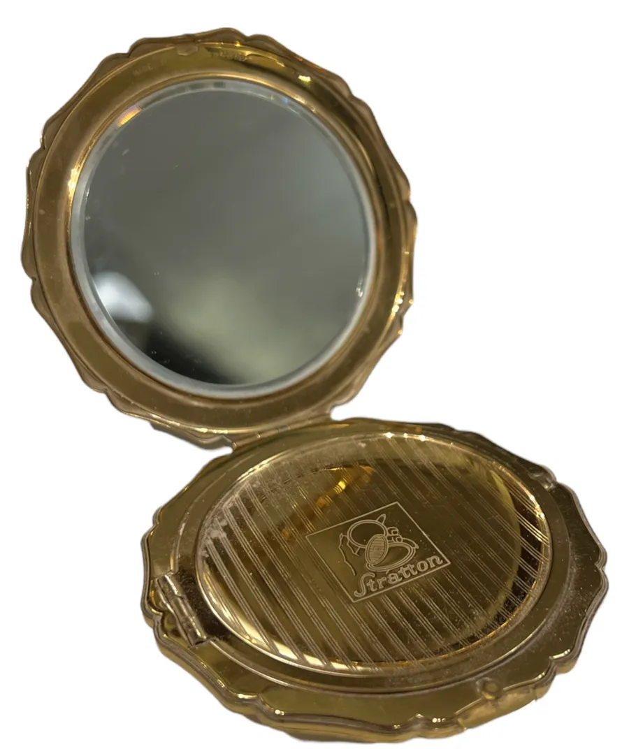 Compacto antigo com espelho decorativo e design clássico