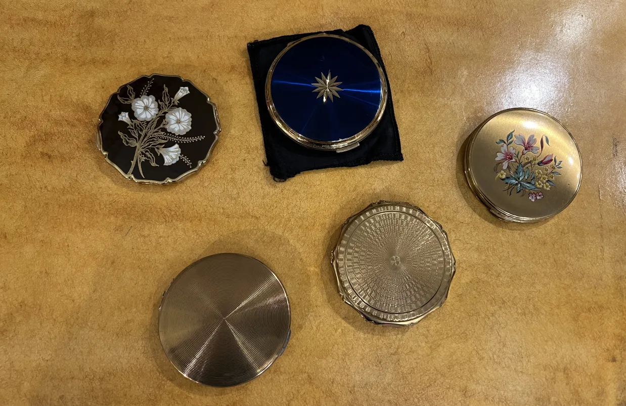 antique compact with colorful floral decorations, elegant