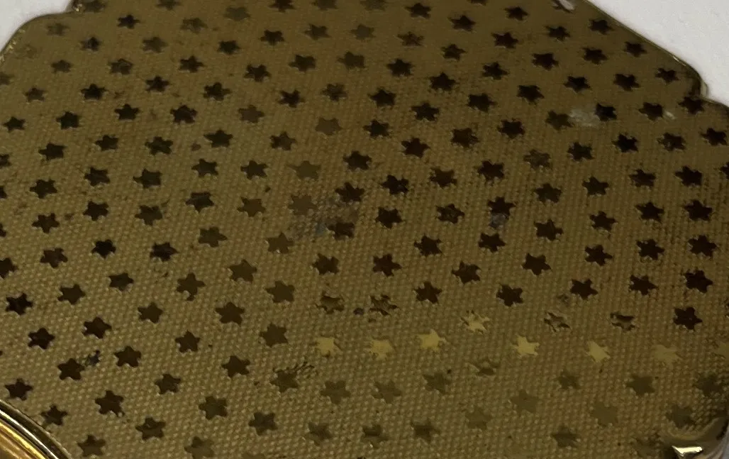polvera antigua stratton england con estrellas doradas