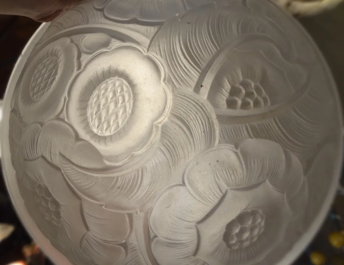 antique ceiling light featuring relief floral carvings