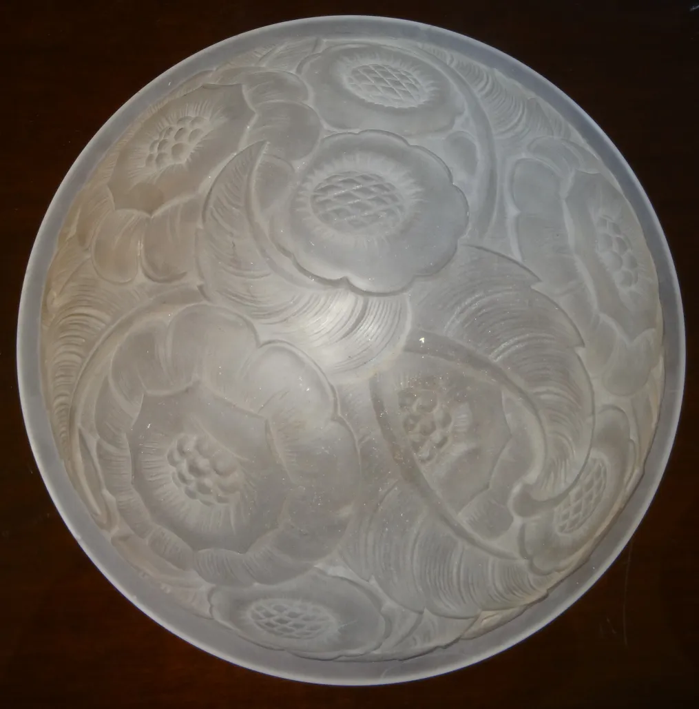 antique ceiling light featuring etched floral details, classic ambiance.