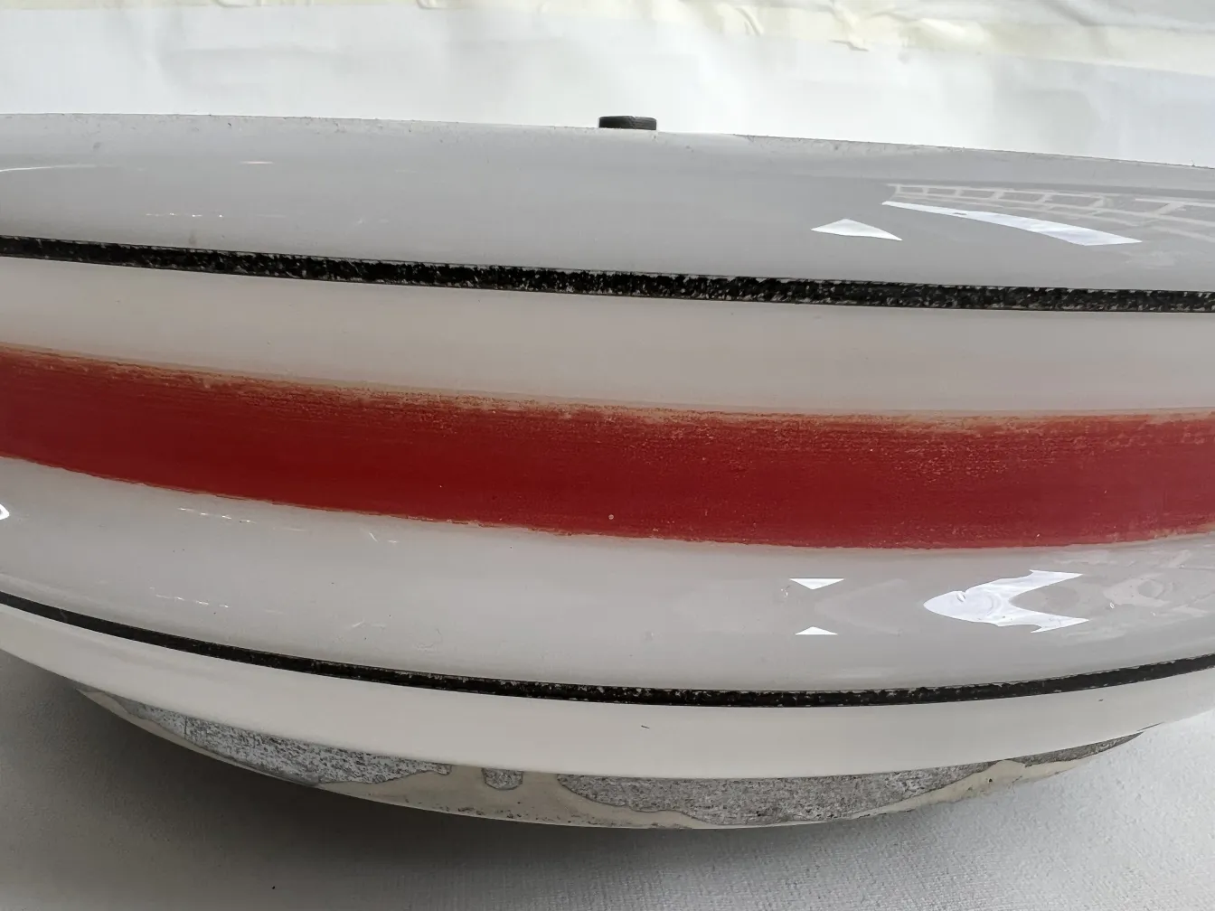 antique ceiling light, white with red stripe, simple decor