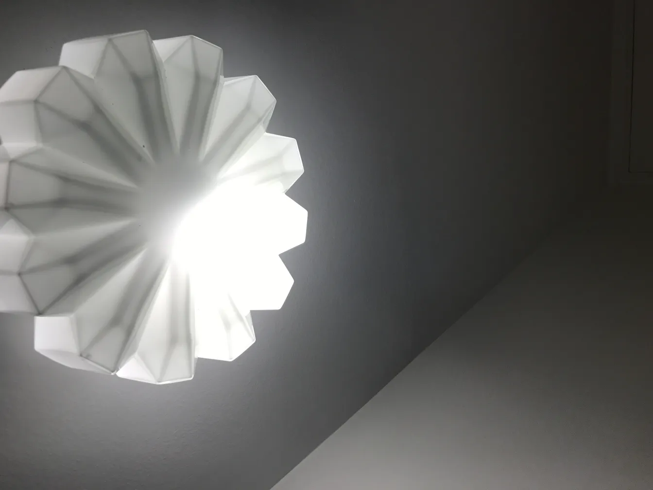 antique ceiling light illuminating a room with a decorative design