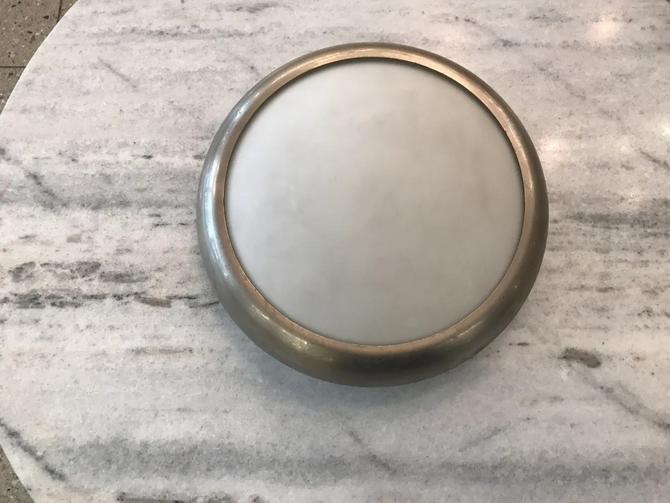 two round ceiling lights with antique border