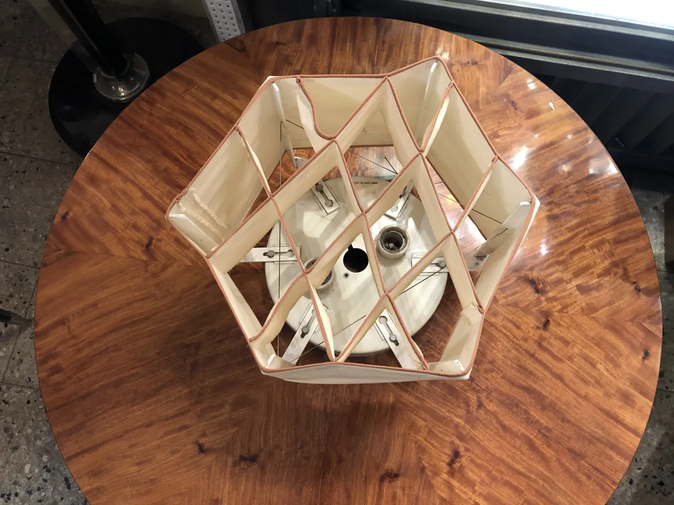 Two vintage ceiling lights with a decorative design on a table