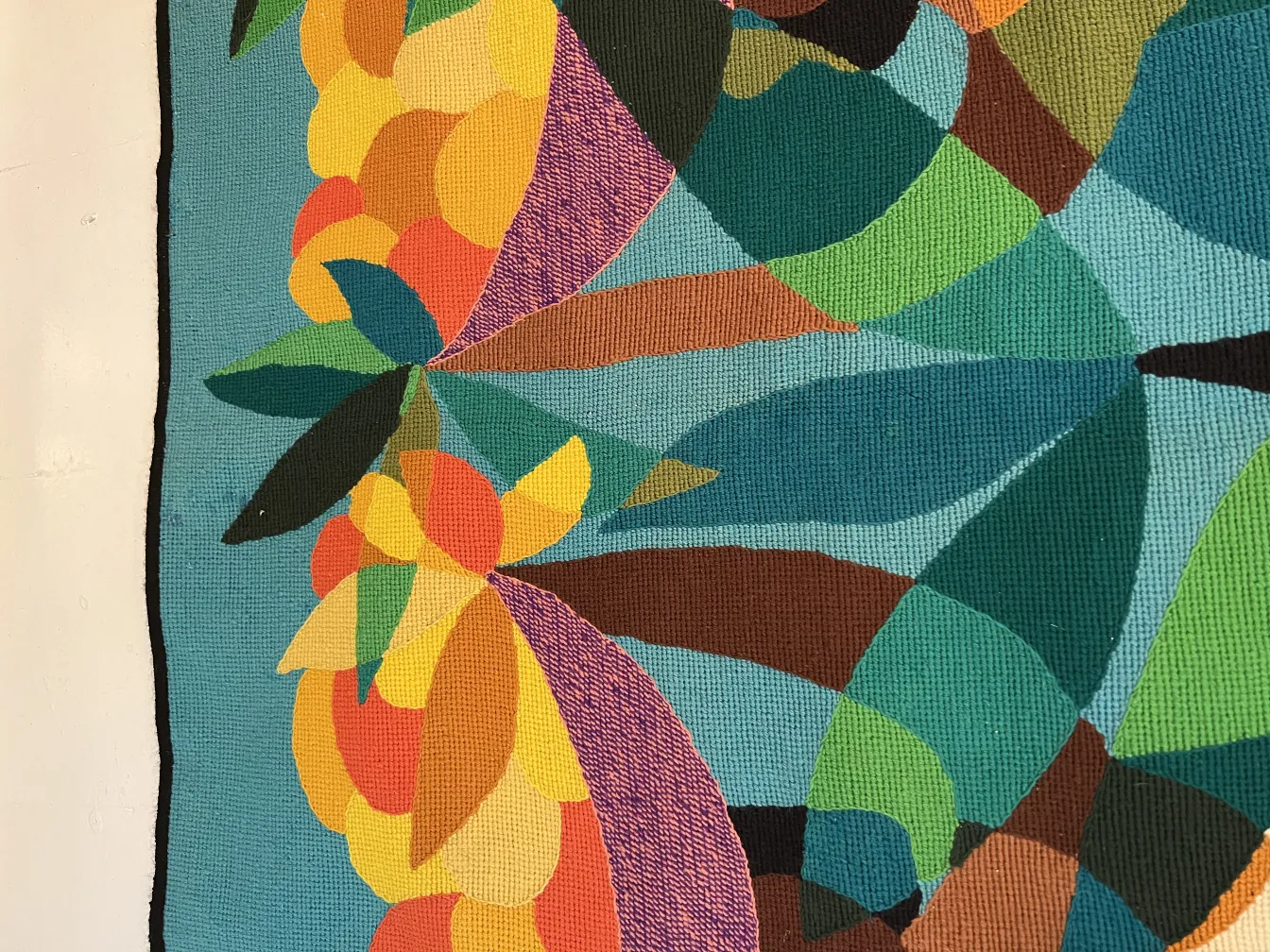 antique colorful tapestry with floral shapes on blue background