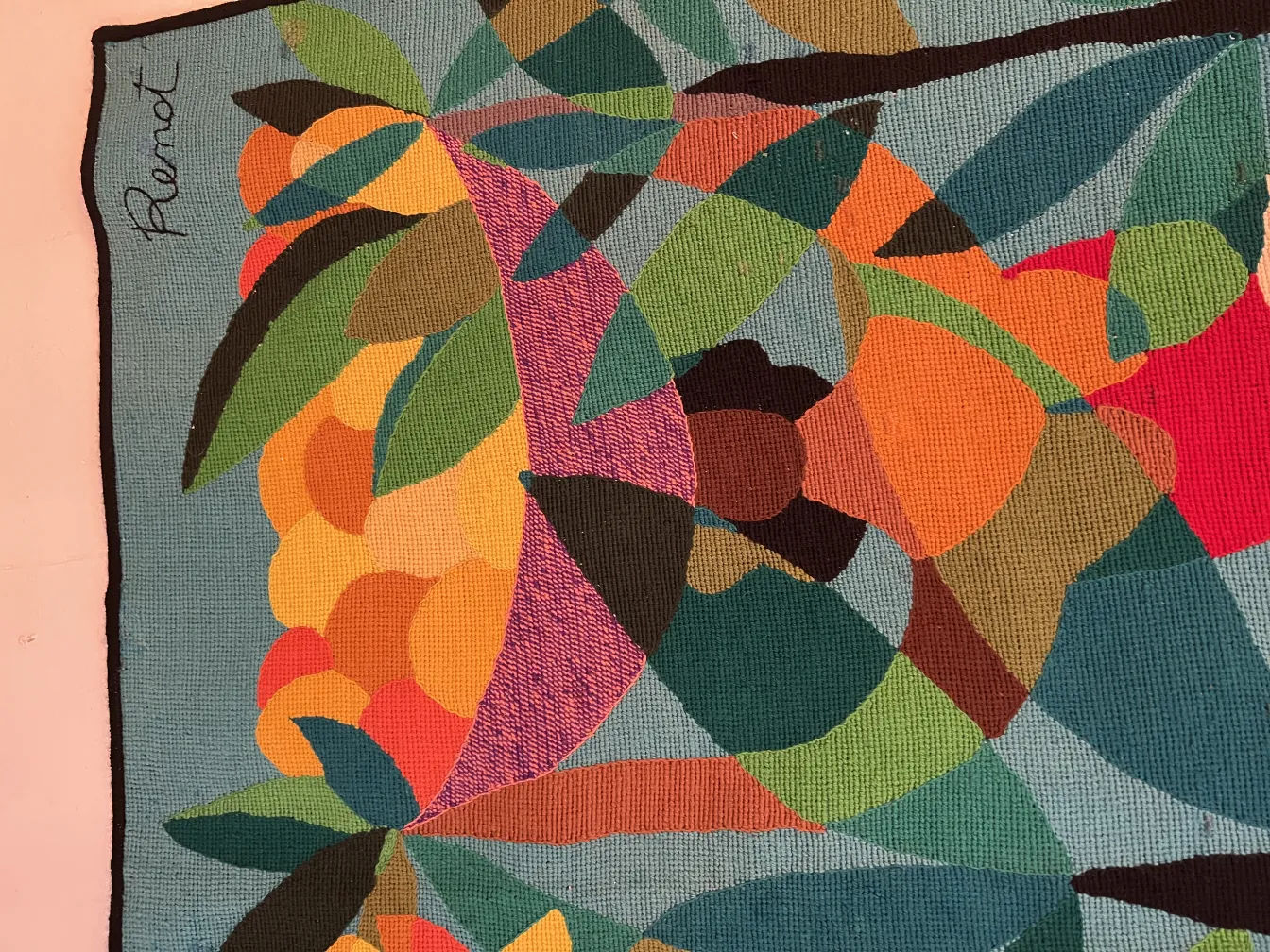 antique tapestry with vibrant colors and leaves