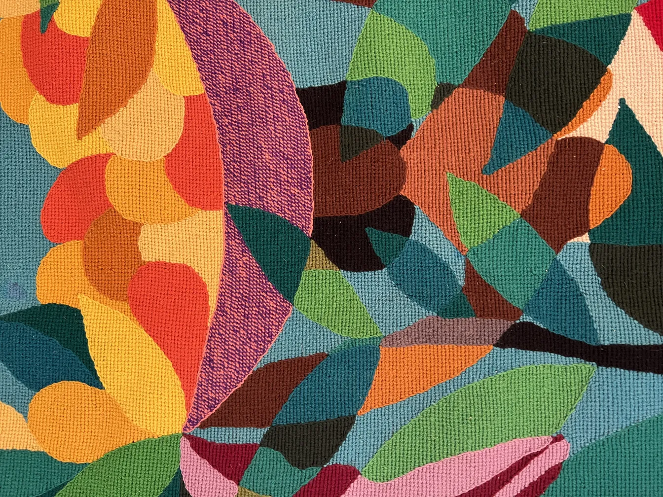 antique tapestry featuring vibrant colors and abstract shapes