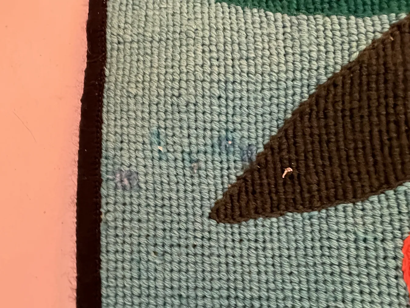 arazzo antico con colori e forme decorative, sfondo morbido