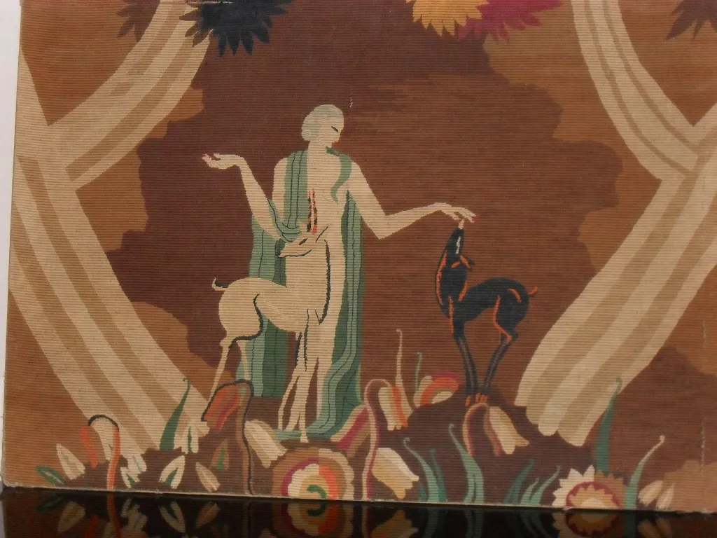 antique tapestry with a background of trees and flowers, featuring animals