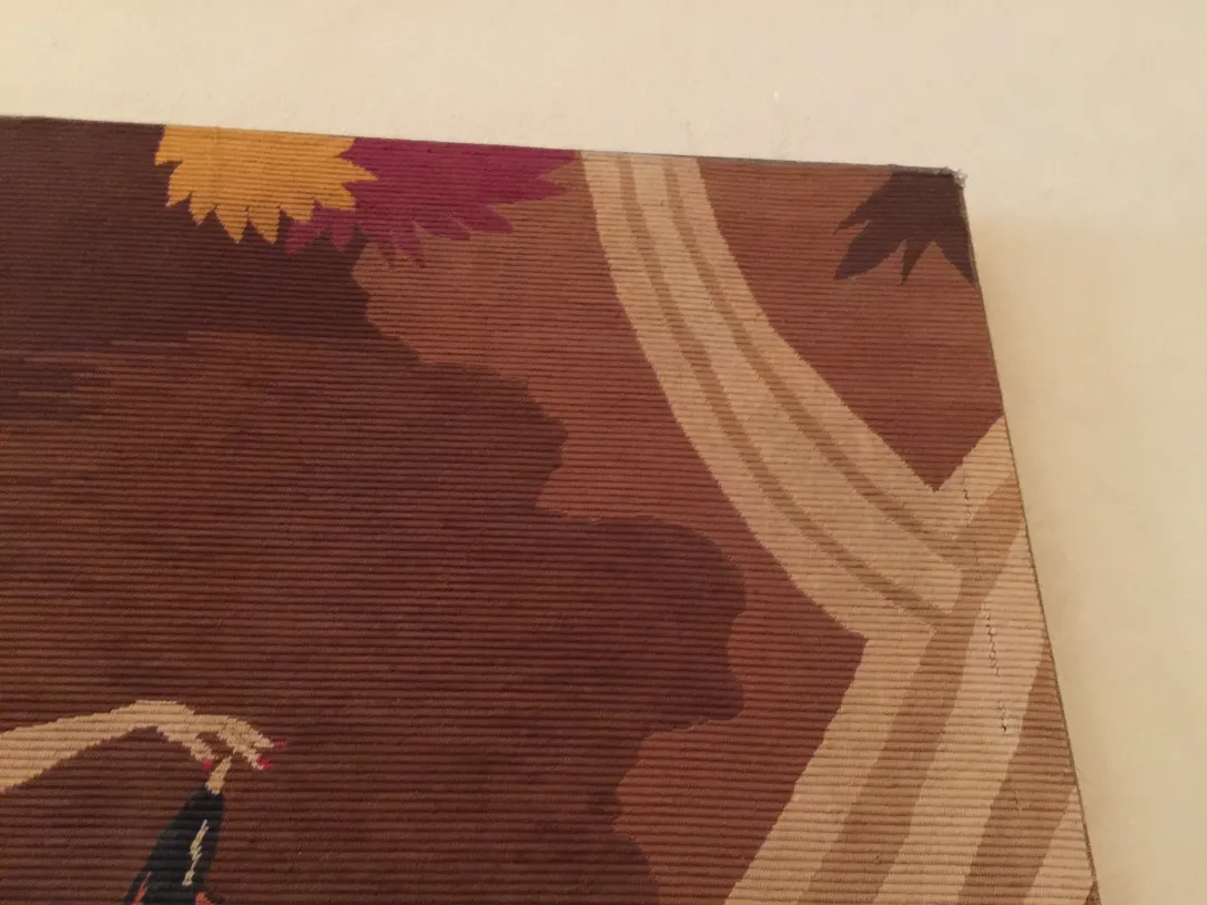 antique tapestry featuring floral design in warm tones