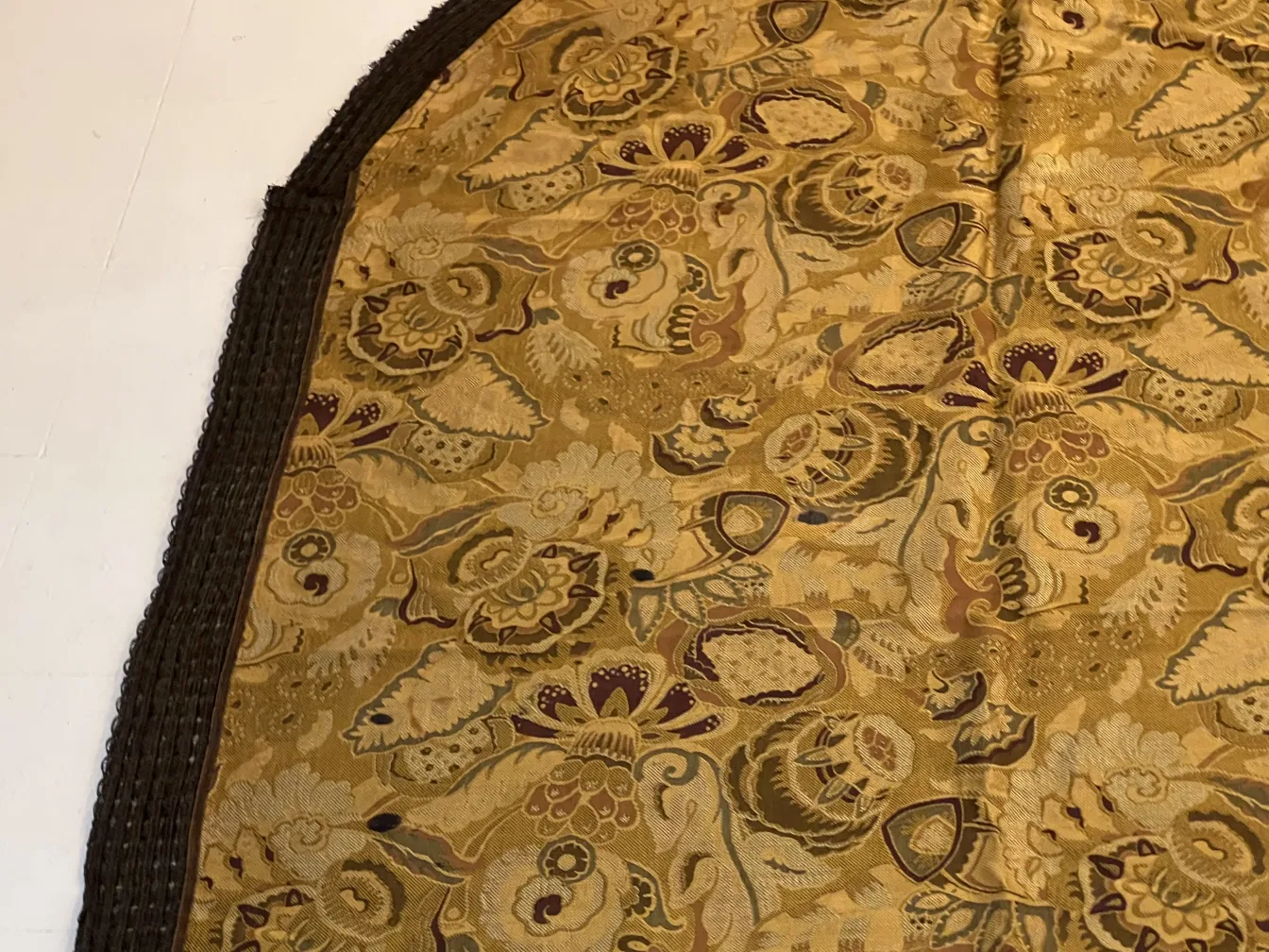 antique tablecloth in golden tones with flowers