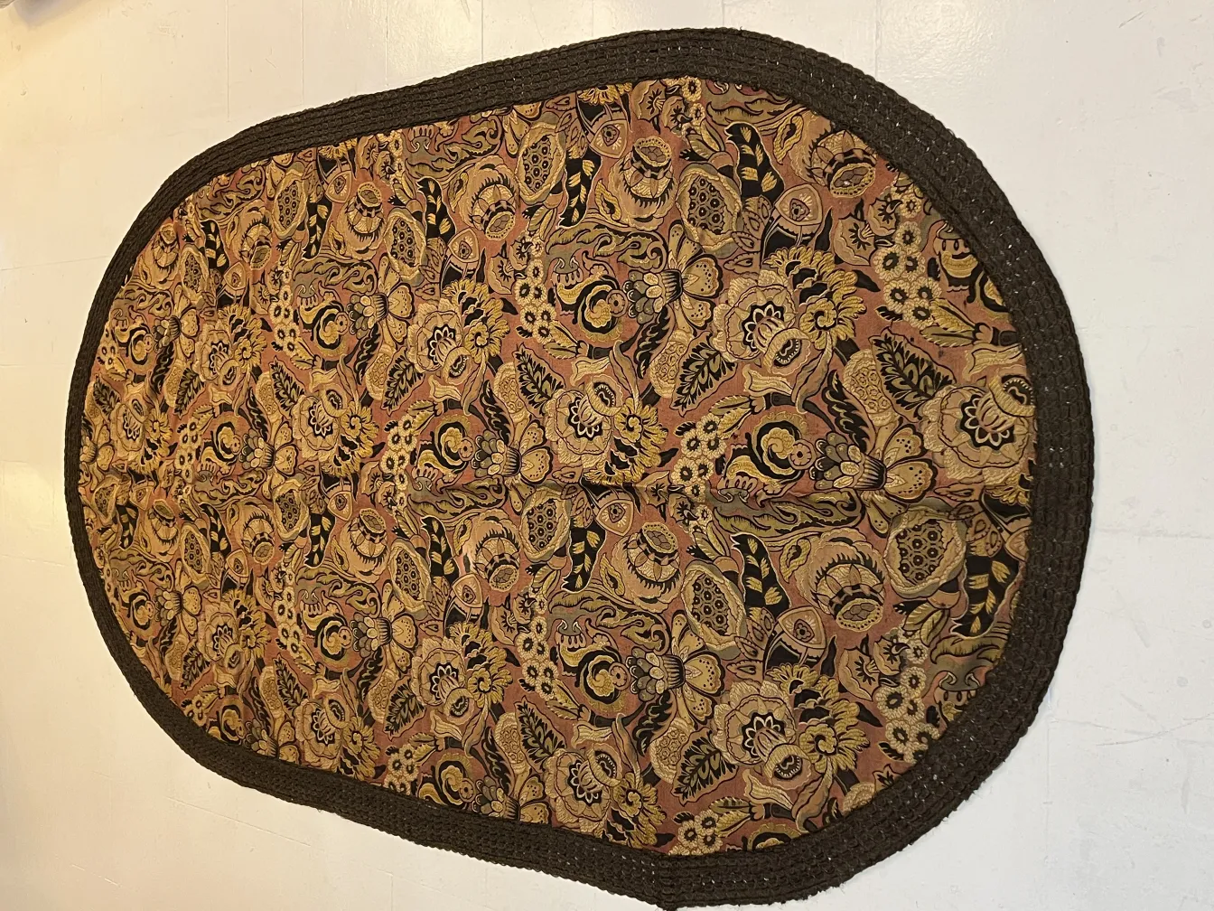 antique tablecloth featuring warm floral design