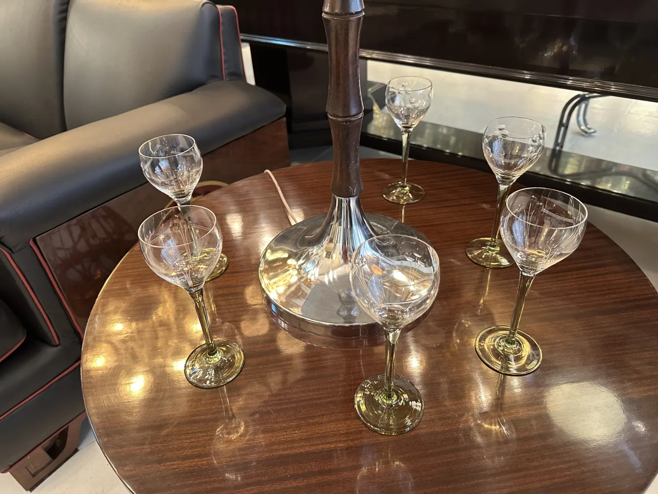Set of 6 antique glasses on wooden table