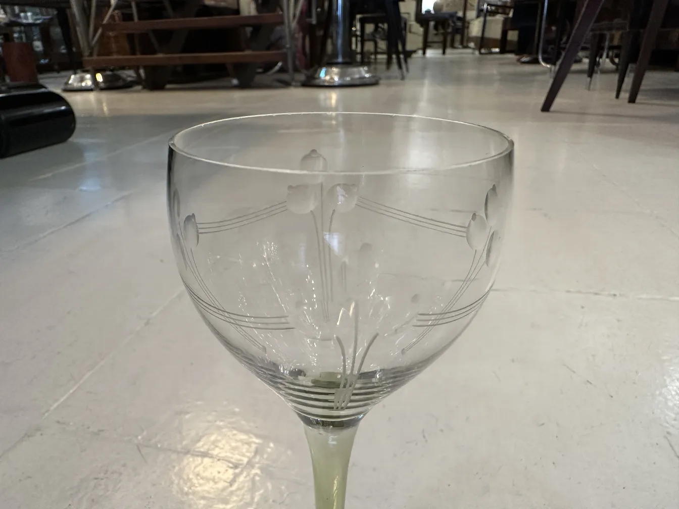 side view of 6 antique glasses with etched designs