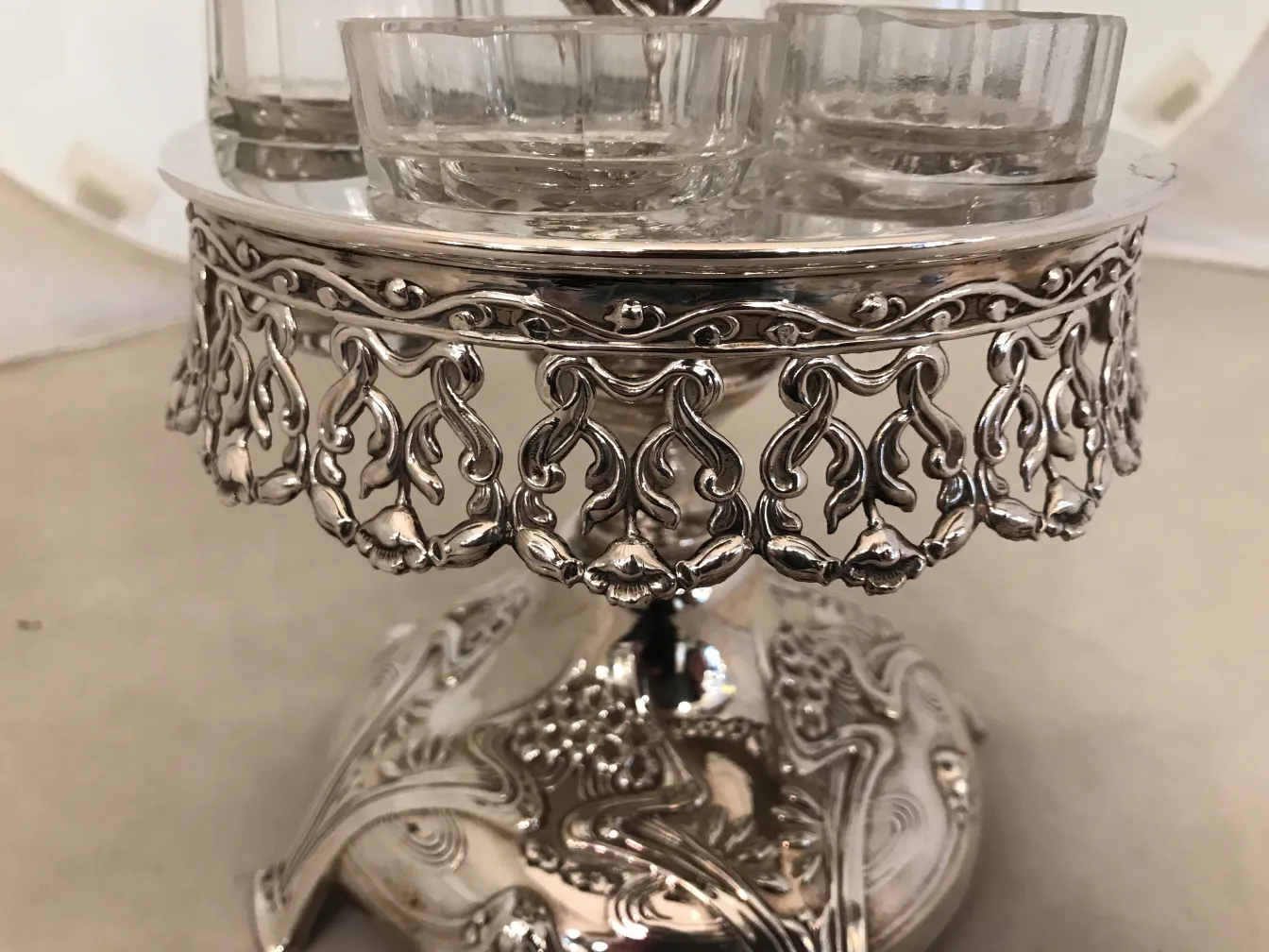 Antique WMF salt and pepper shakers with decorative stand.