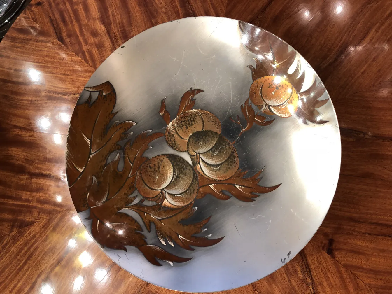 Antique pastry plate with engraved floral designs, elegant