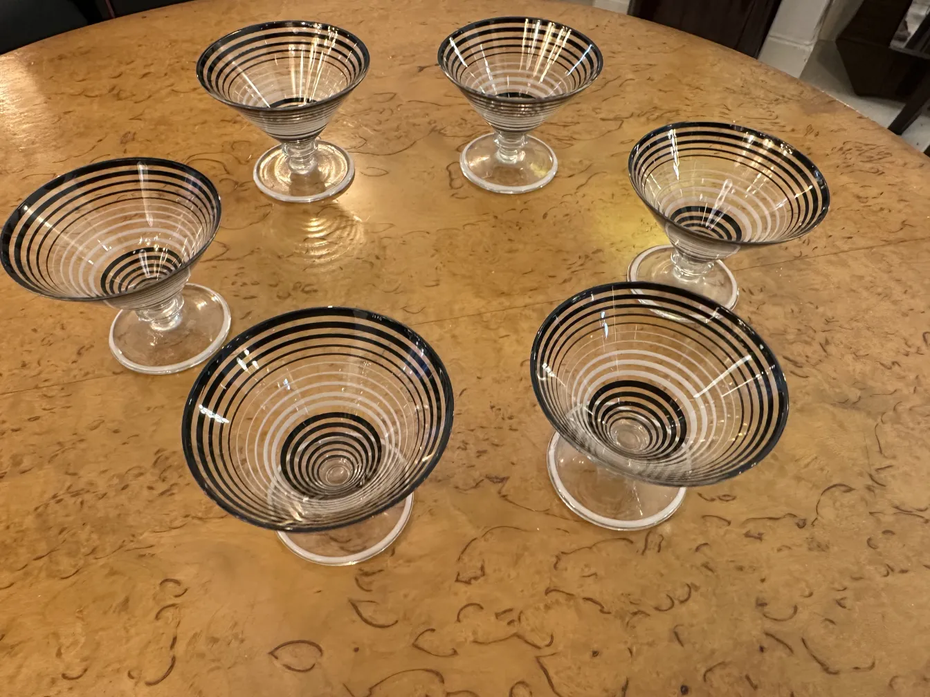 antique liqueur set and glasses with elegant striped design on a table