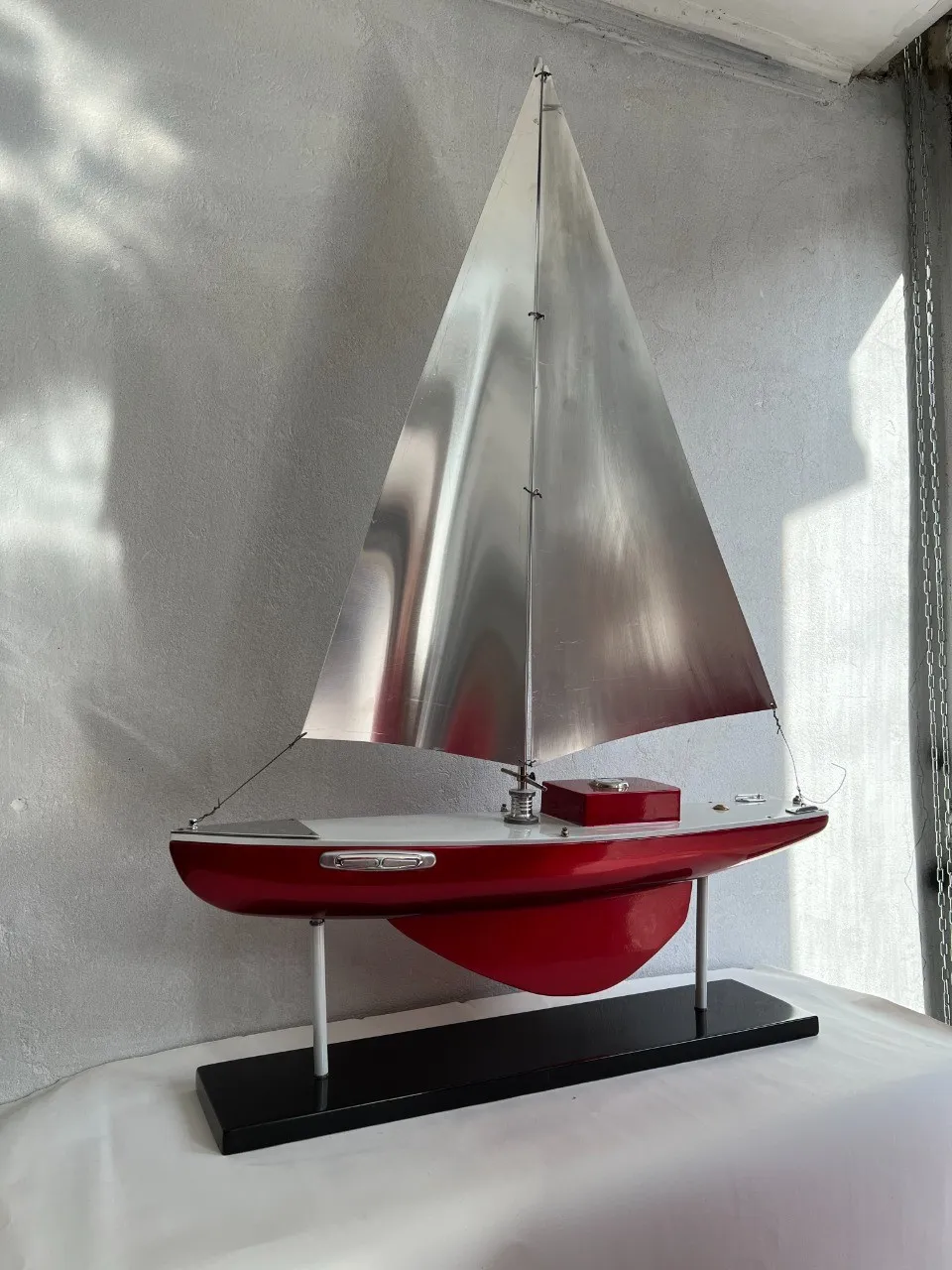 Designer’s ship with silver and red sails.
