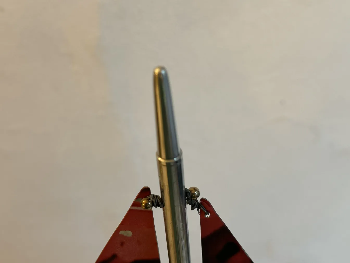 Antique designer's ship with metallic and red parts