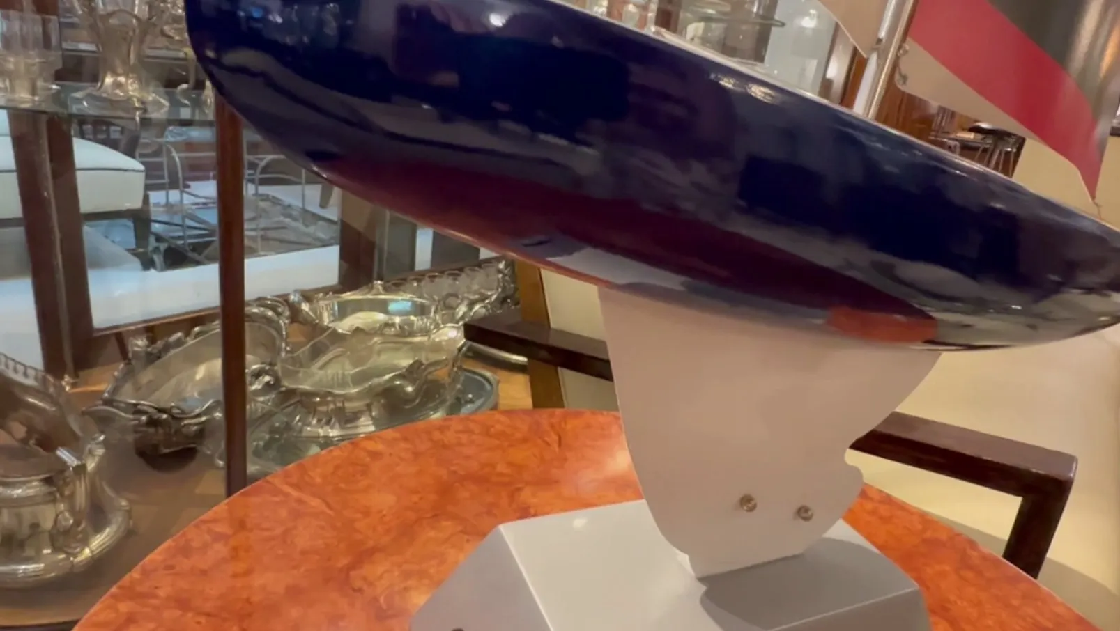 Side view of a designer's ship with white base and blue color