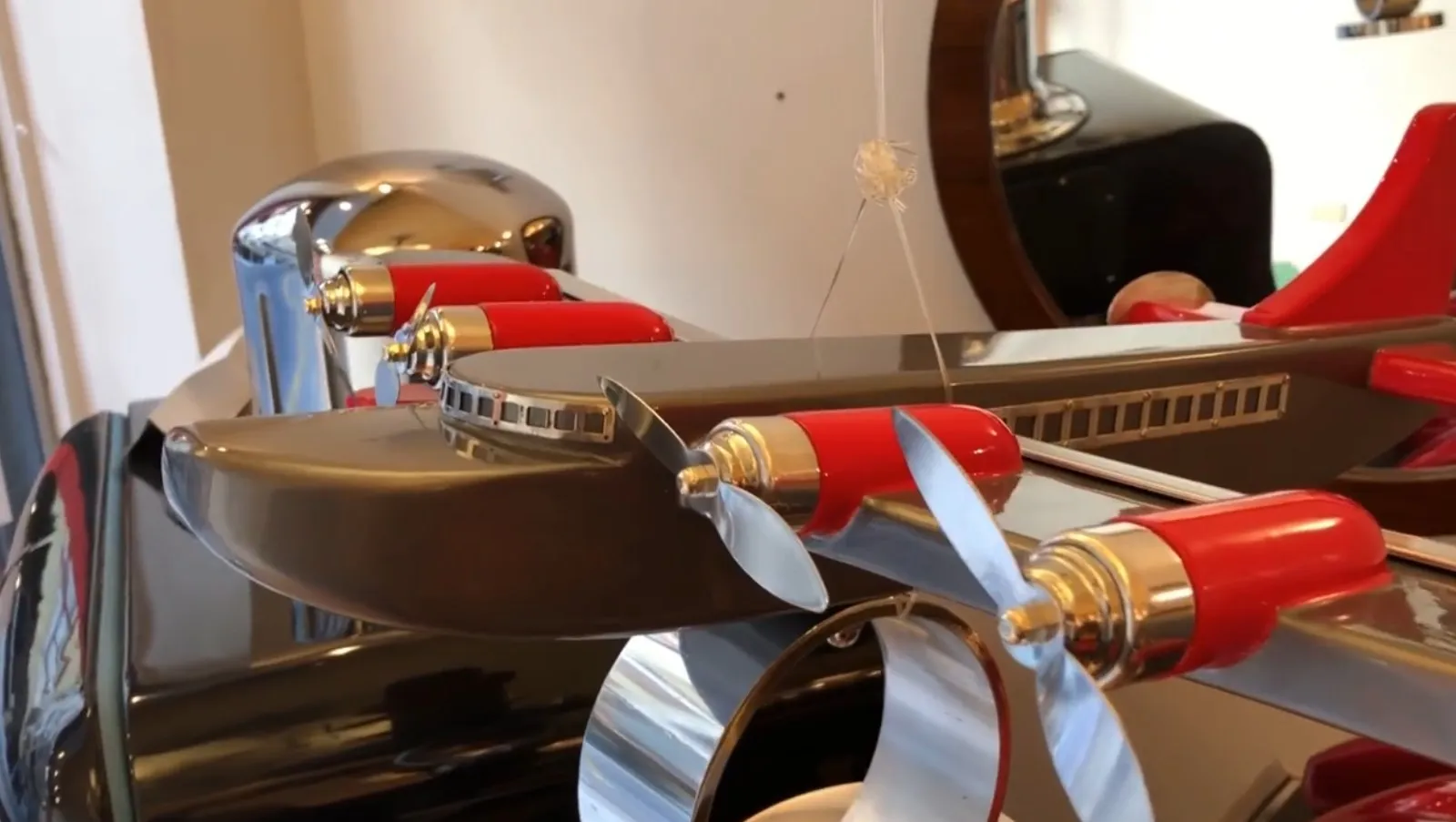 detail of antique designer marcelo pena aircraft with propellers