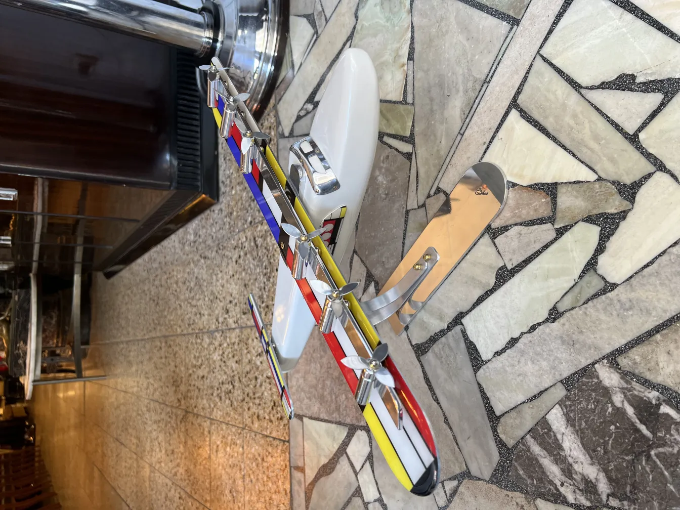 colorful aircraft model by designer Marcelo Peña in an antique setting