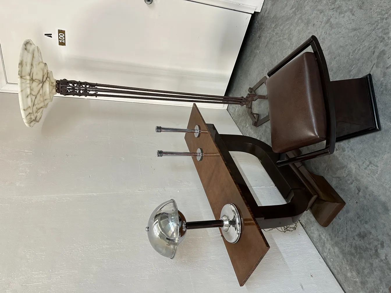 detailed view of an antique console table with lamp