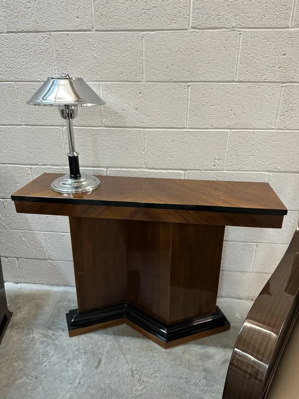 antique consoles with elegant design, accompanied by a lamp