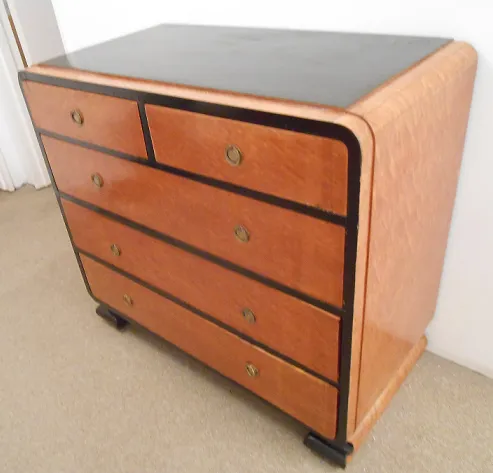 Antique cabinet with a classic design featuring four drawers.