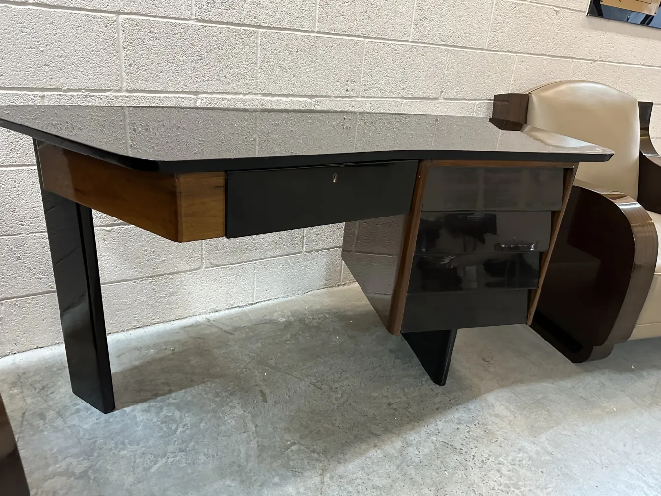 Antique desk with two drawers and distinctive style in a modern setting