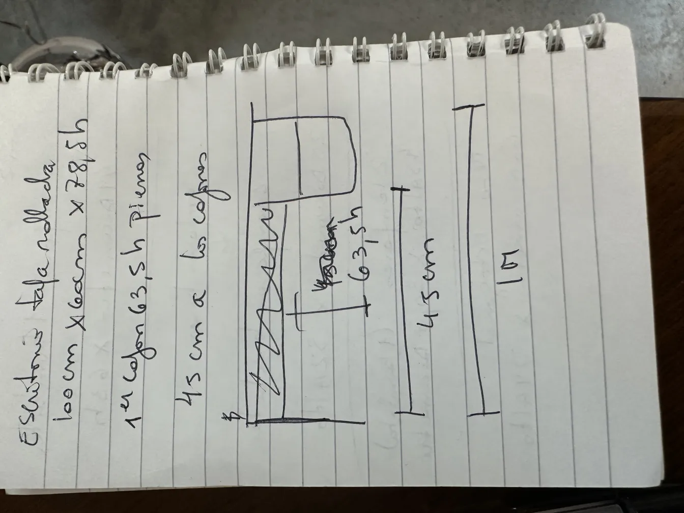 Antique desk featuring a technical drawing on paper