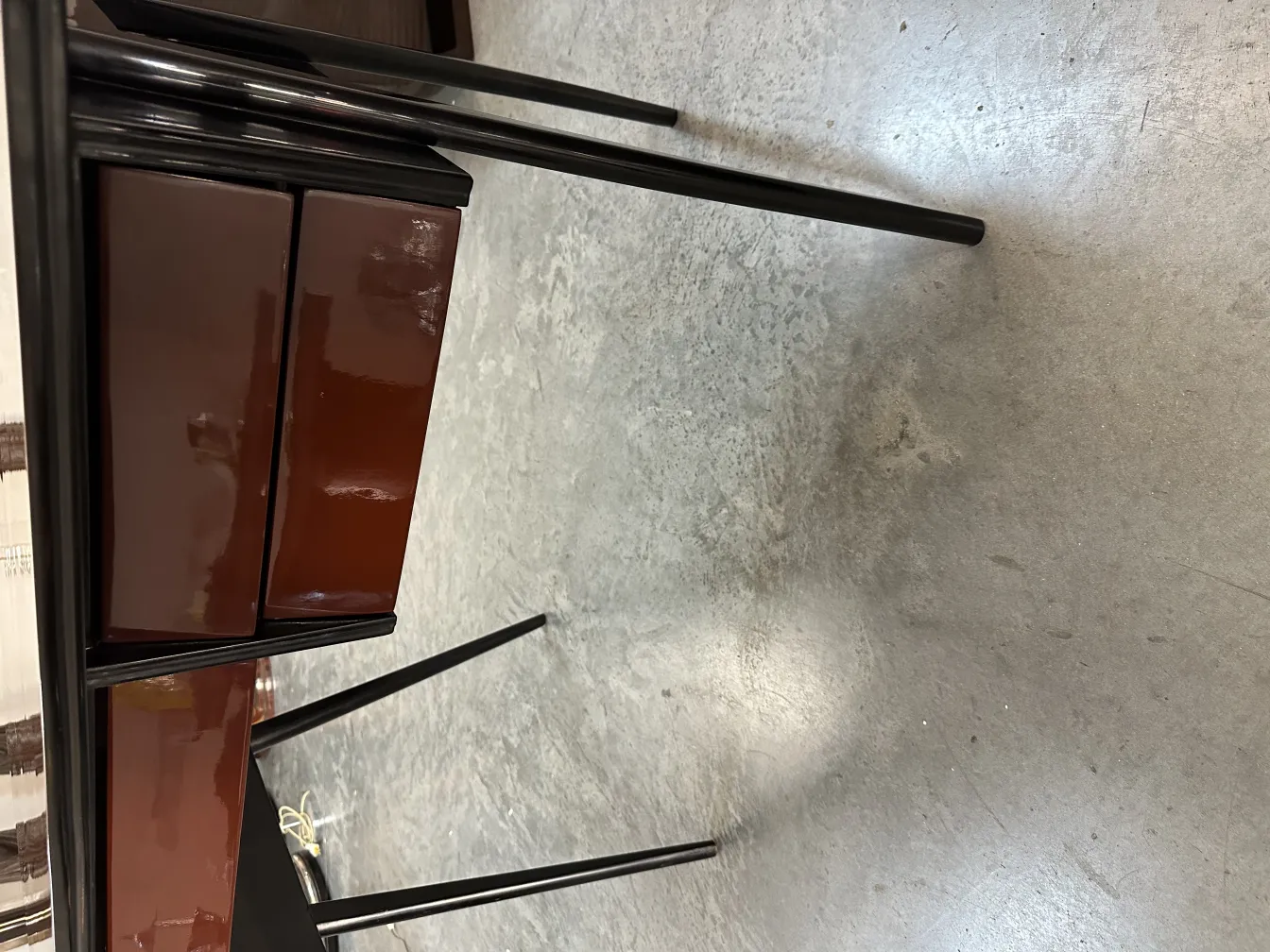 antique desk with two drawers and black legs