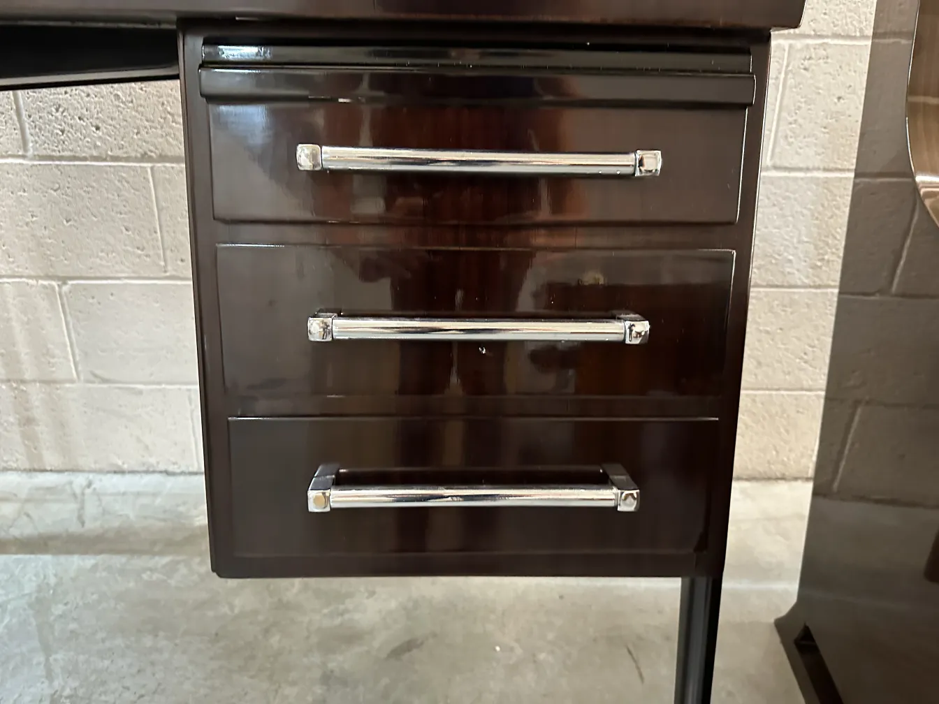 antique desk with metal handles and drawers, neutral background