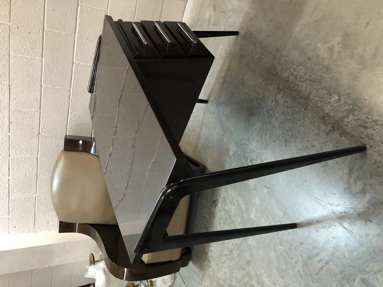 antique desk with chairs in a light setting