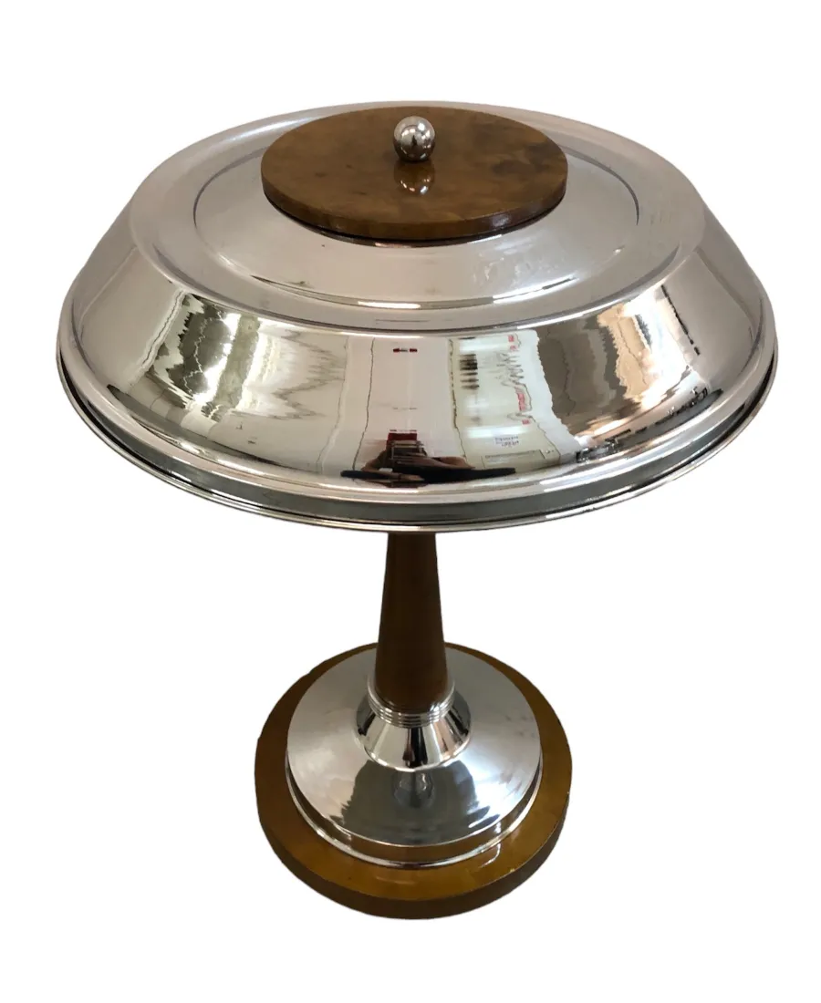 two antique table lamps with silver base and round shape in a neutral setting