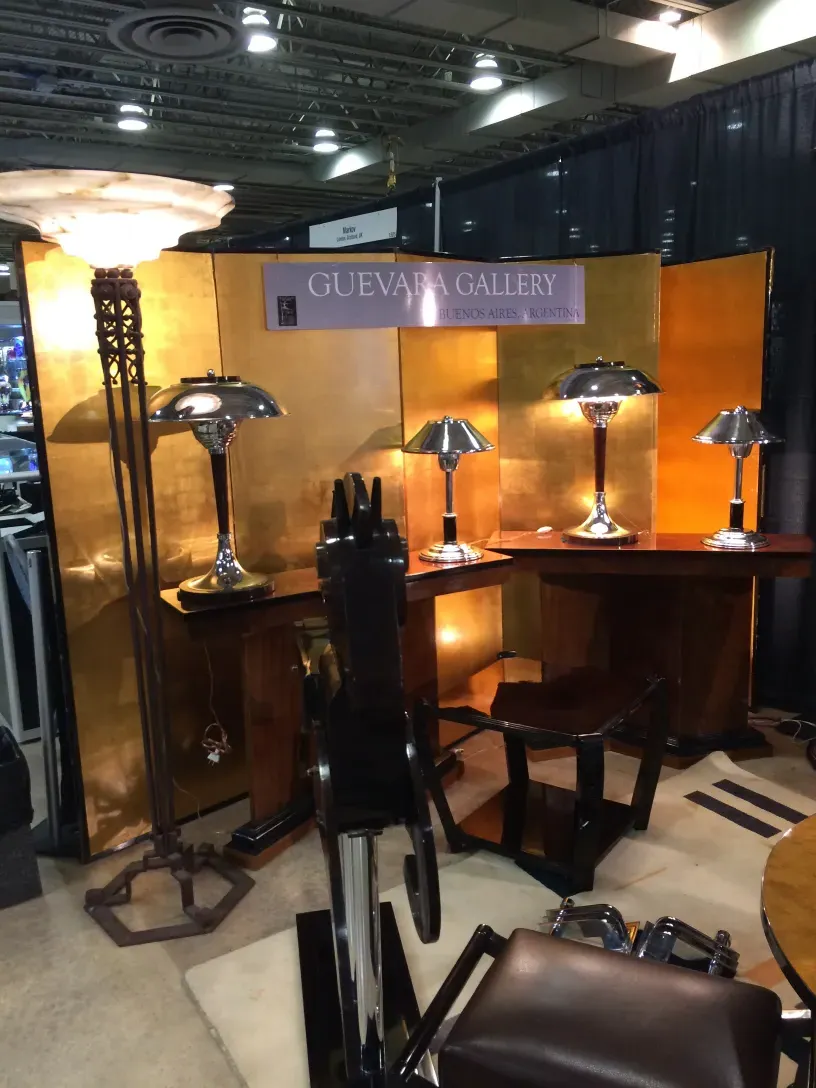 Two antique table lamps, shiny and elegant in a decorative setting.