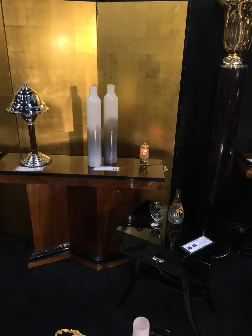 Two antique table lamps with sophisticated details in an elegant setting.