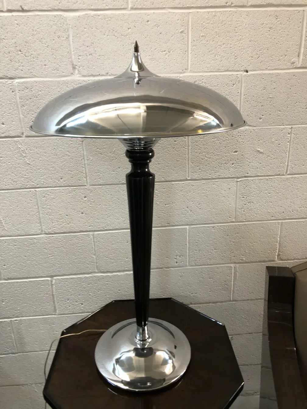 two antique table lamps, one with a black base and shiny shade