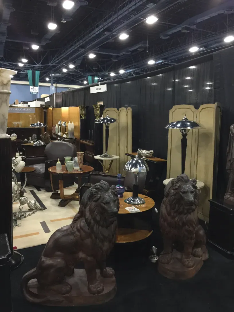 two antique table lamps in a stylish and cozy setting, surrounded by other decorative items.