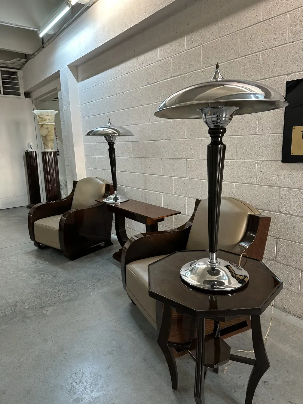 two antique table lamps with elegant bases and wide shades, cozy atmosphere