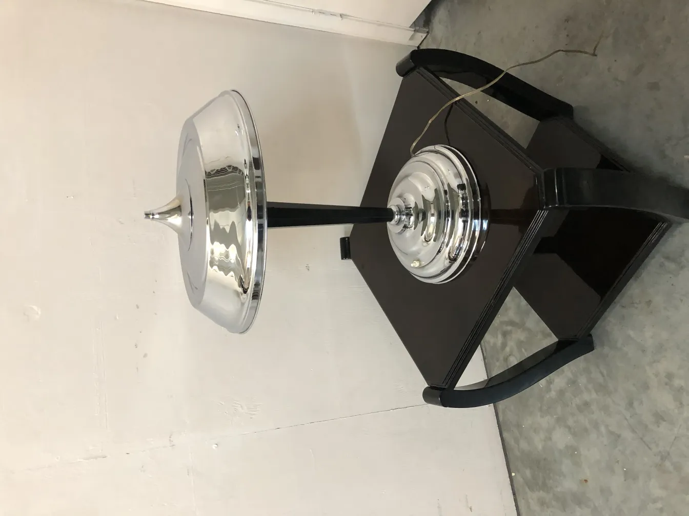 Antique table lamp with bright design on a black table