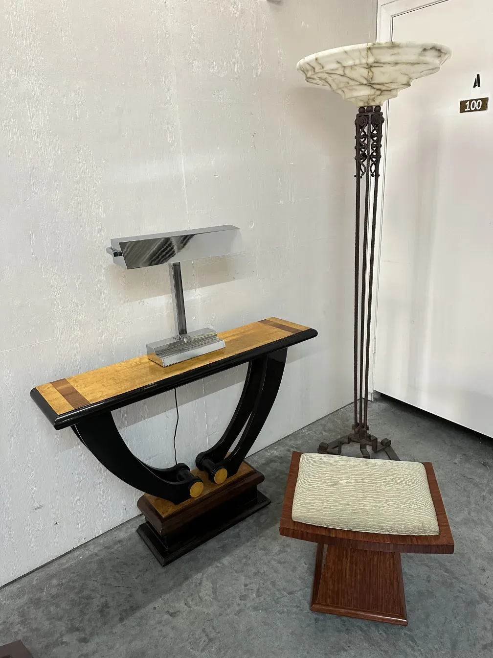 Antique table lamp with decorative base in an elegant setting.