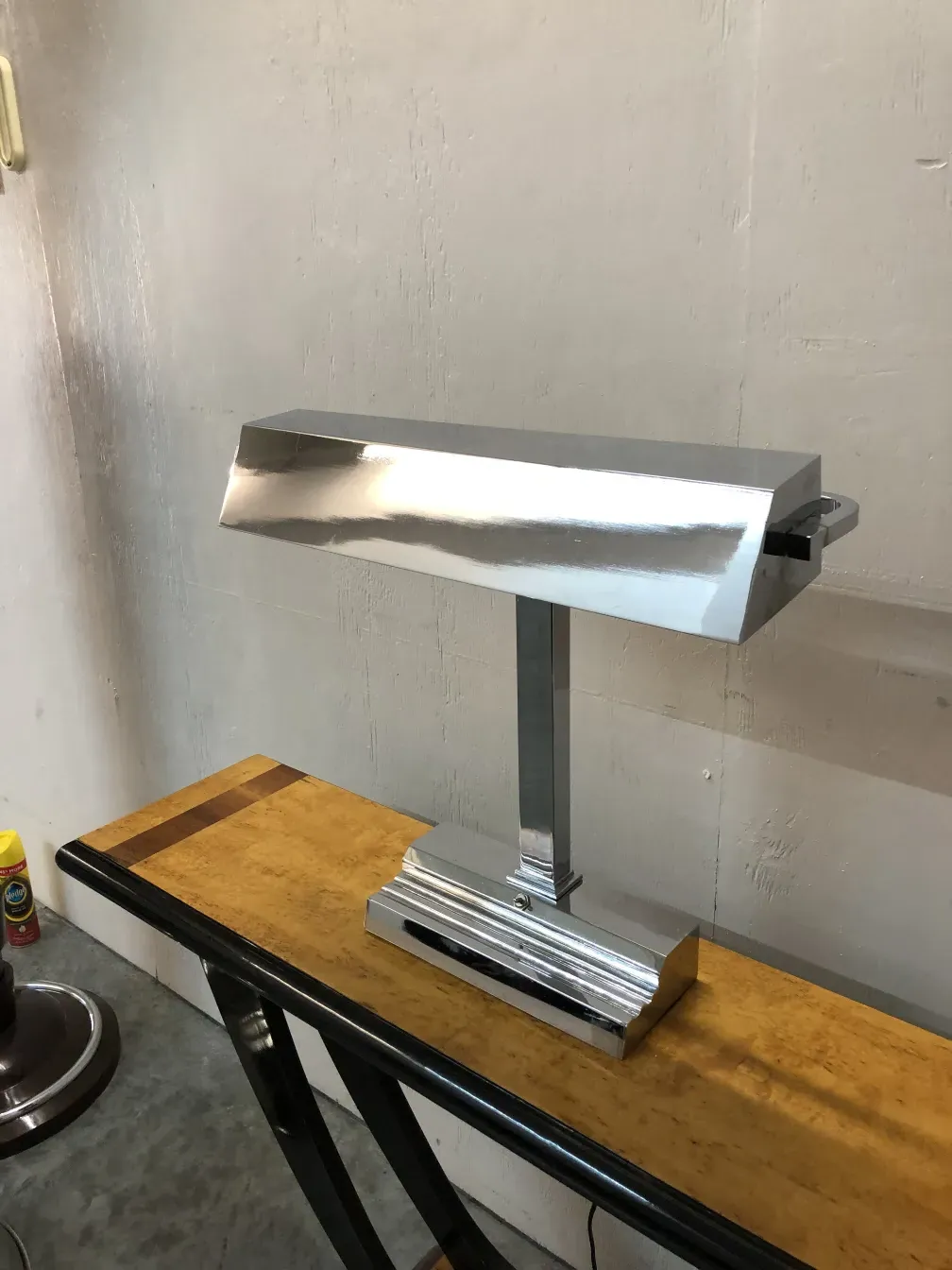 table lamp with a shiny steel base and modern design