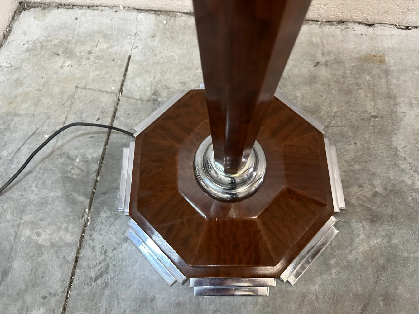 Top view of two antique floor lamps in a simple setting.