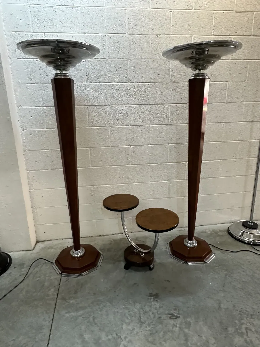 view of 2 antique floor lamps with elegant structure and hexagonal bases in a modern setting