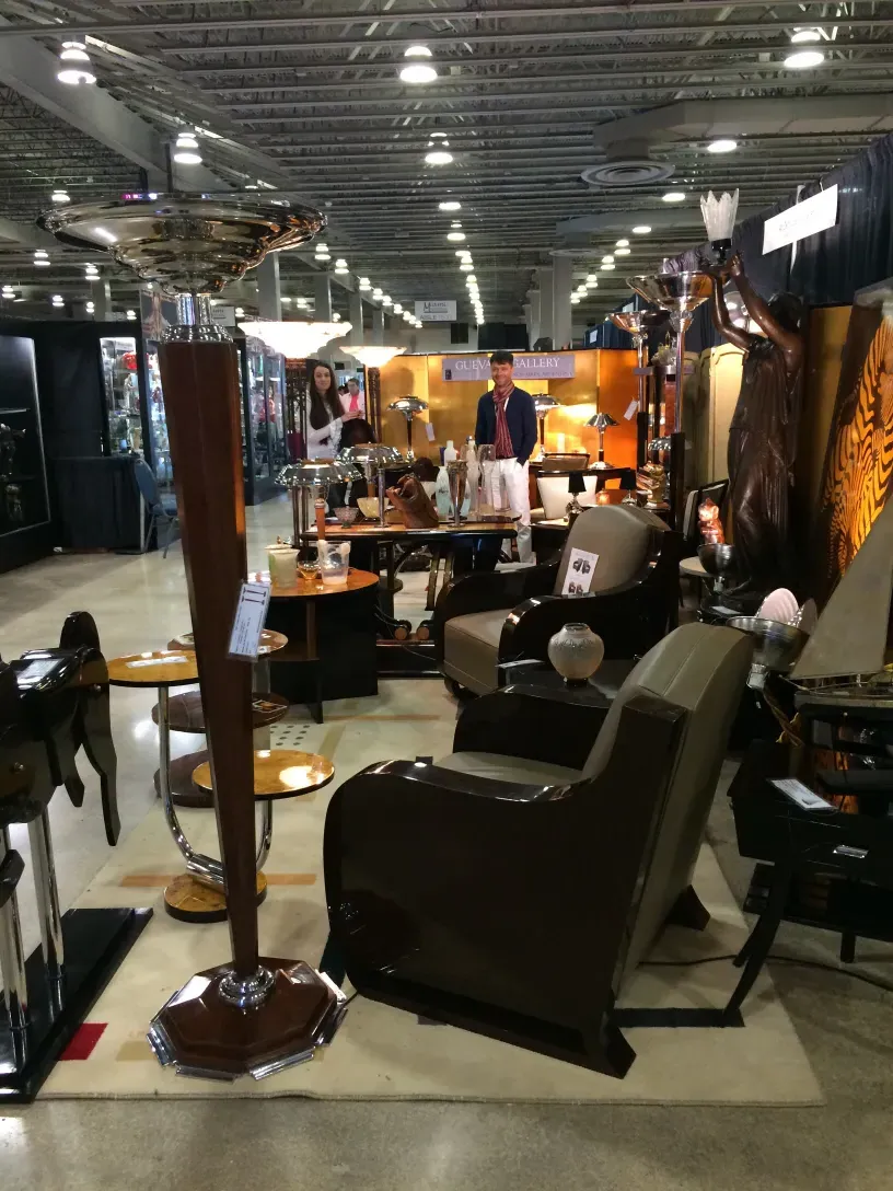 two antique floor lamps in a display environment