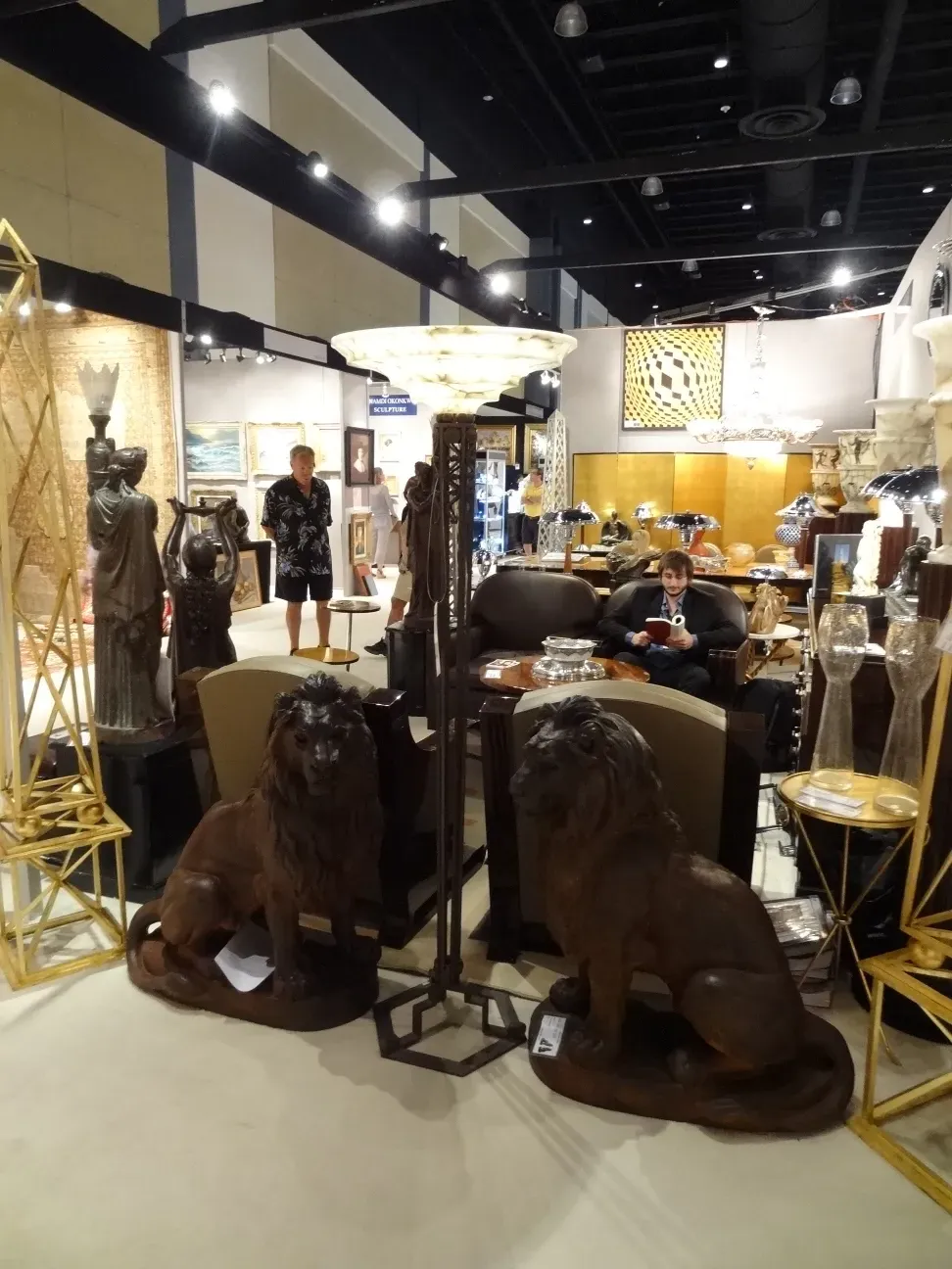 two antique floor lamps in an elegant setting with decorative lions