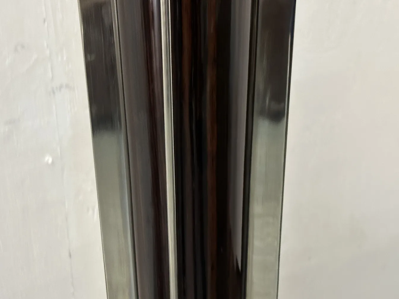 two antique floor lamps with classic design in neutral setting