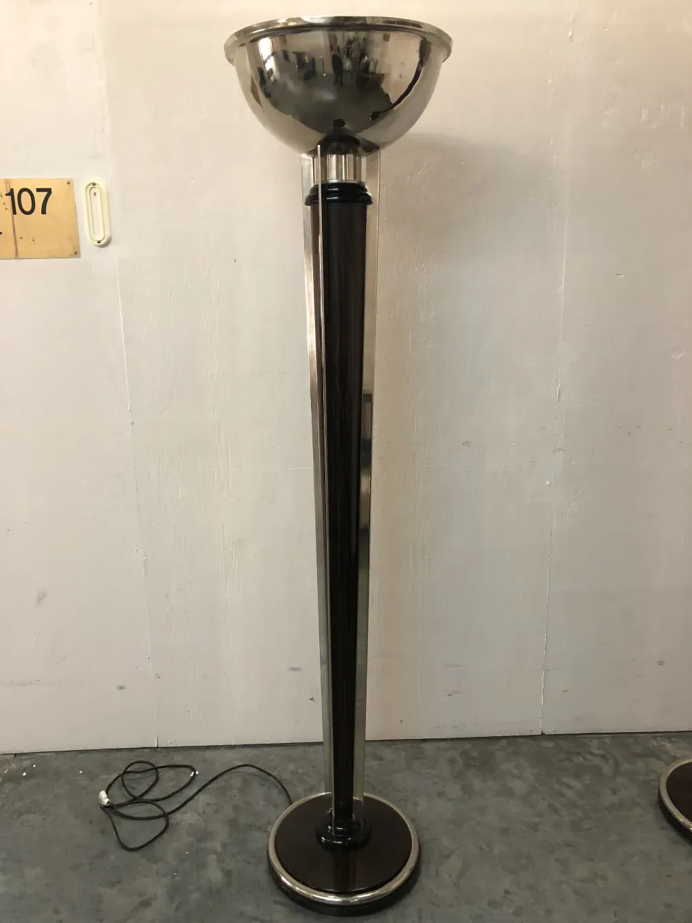 Two antique floor lamps with an elegant design